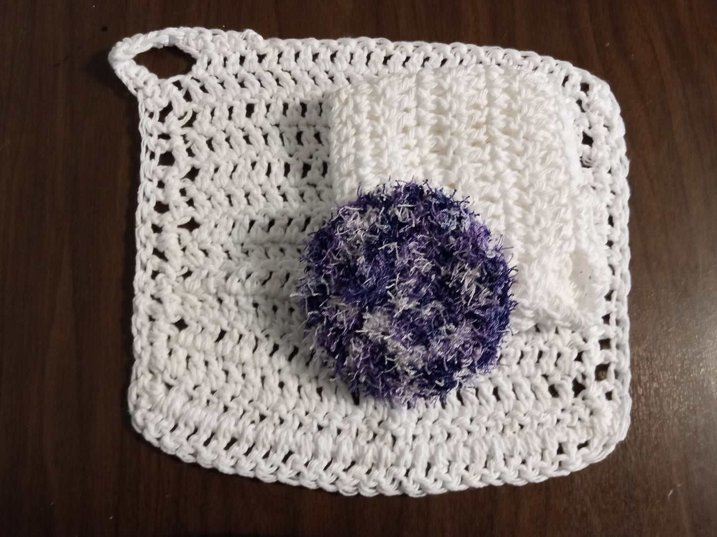 White dishcloth with Purple Scrub Eaze Scrubby